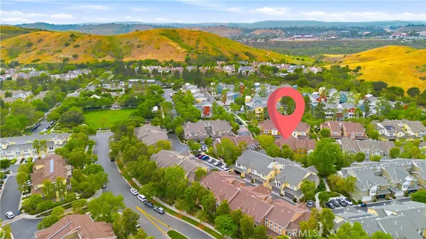 an aerial view of residential houses with outdoor space