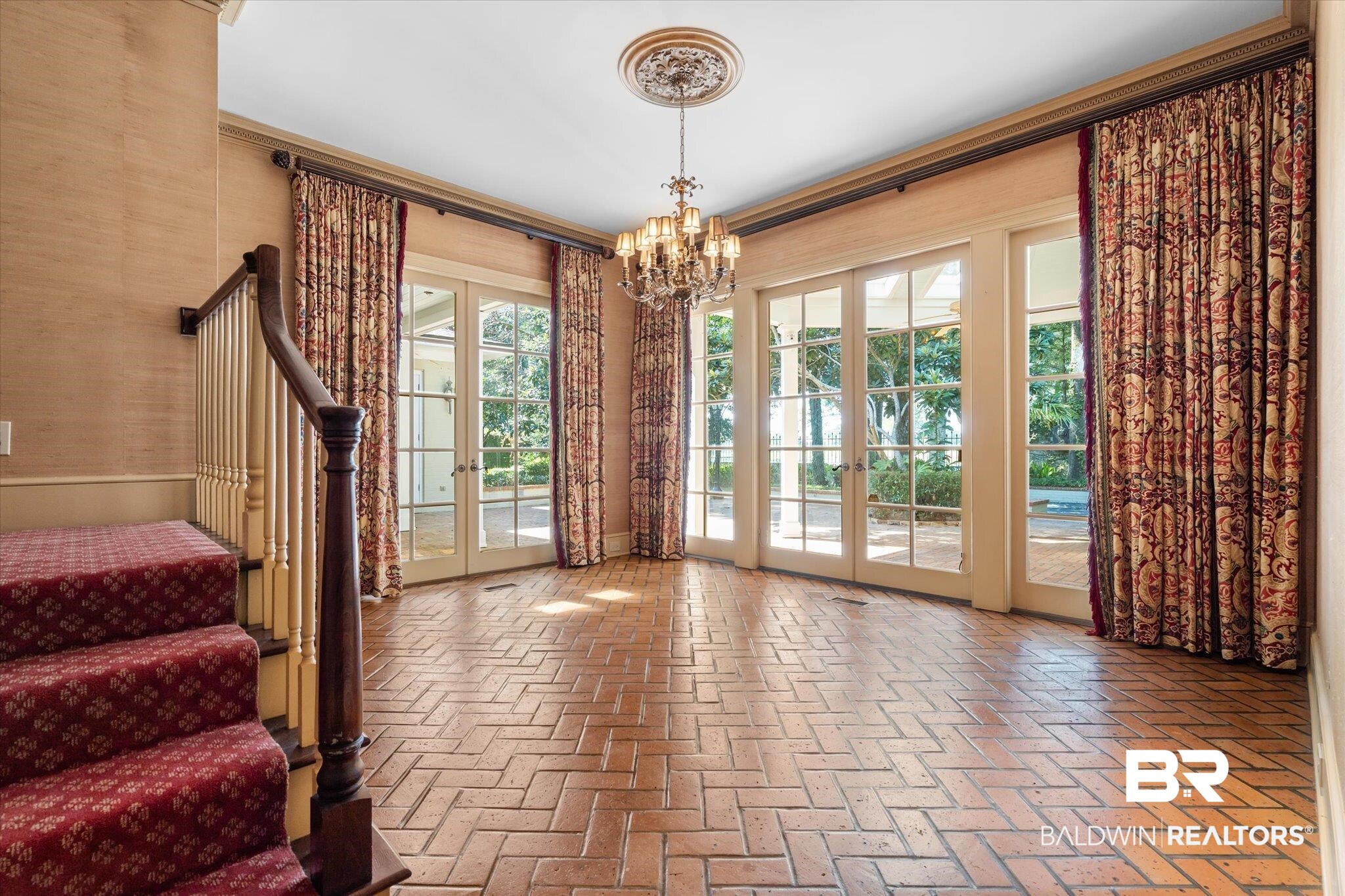 54 Turnin Lane Mobile, AL 36608 - Photo 12 of 35 Doorway to outside featuring a healthy amount of sunlight, french doors, and an inviting chandelier