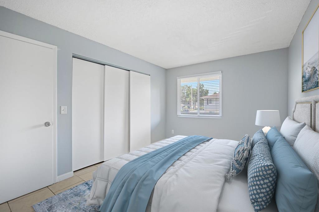 638 Golden Raintree Place Brandon, FL 33510 - Photo 12 of 21 a bedroom with a bed and a window