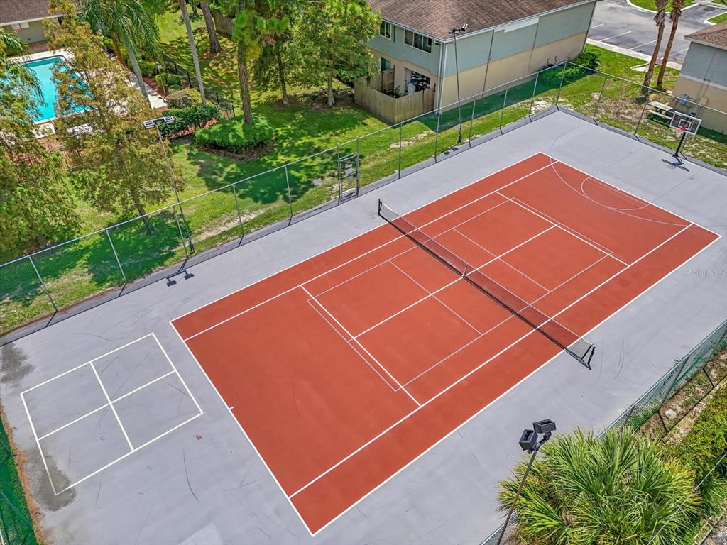 638 Golden Raintree Place Brandon, FL 33510 - Photo 21 of 21 a view of a tennis court with potted plants in front of it