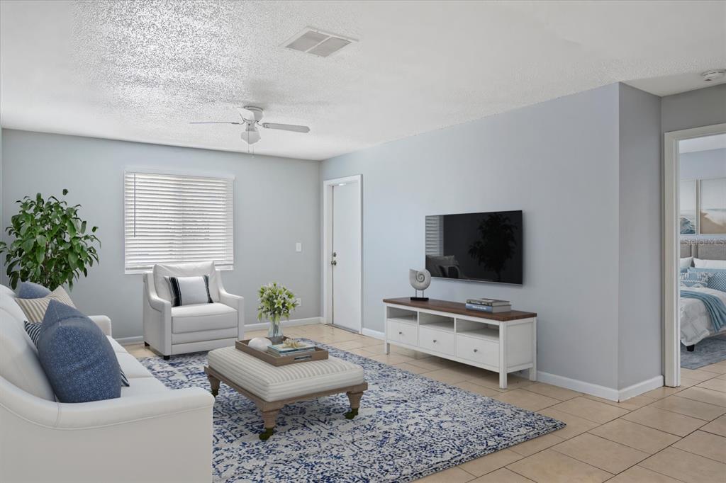 638 Golden Raintree Place Brandon, FL 33510 - Photo 3 of 21 a living room with furniture and a flat screen tv