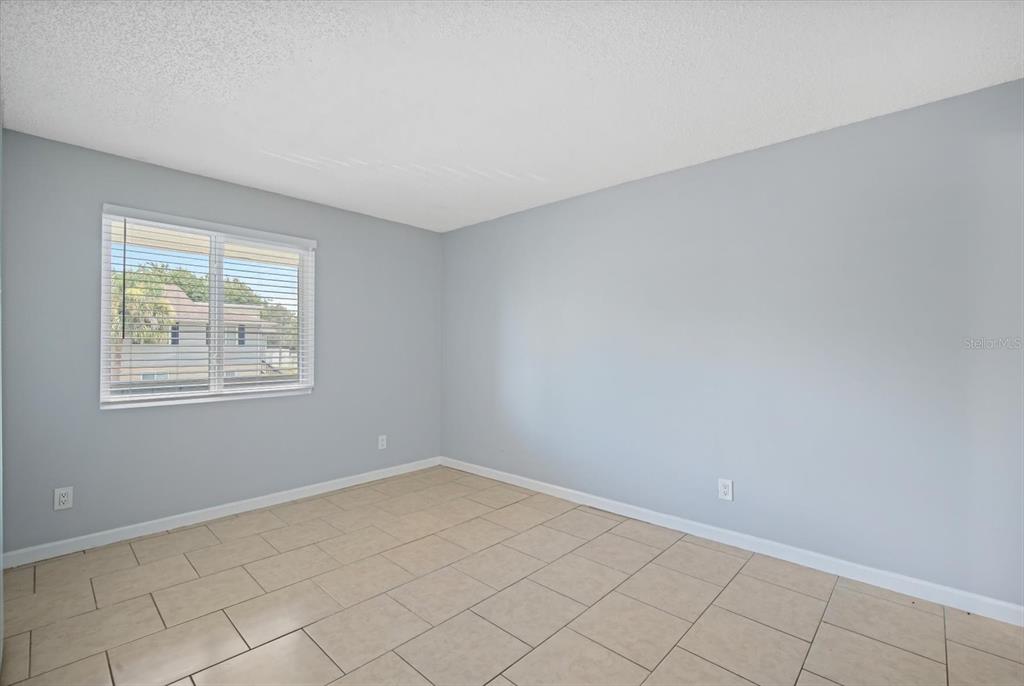 638 Golden Raintree Place Brandon, FL 33510 - Photo 10 of 21 an empty room with windows