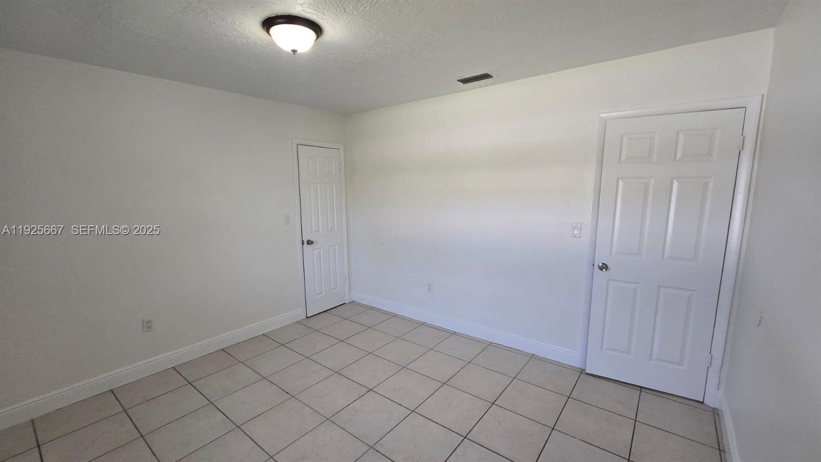 6134 Southwest 40th Court Miramar, FL 33023 - Photo 15 of 15 a view of an empty room and window