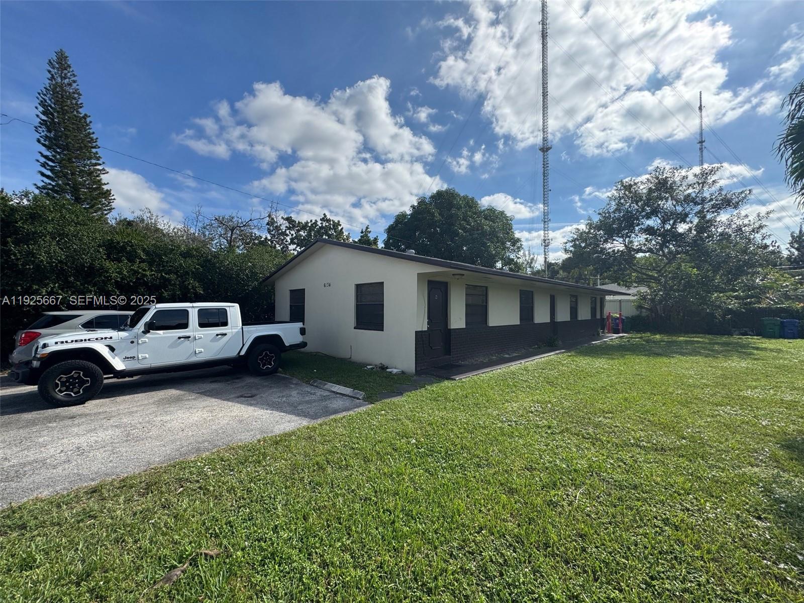 6134 Southwest 40th Court Miramar, FL 33023 - Photo 3 of 15 a view of a car in front of house