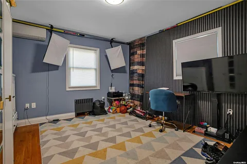 a bedroom with furniture and a window