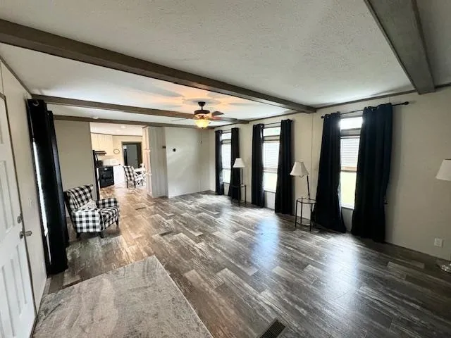 a view of a livingroom with wooden floor