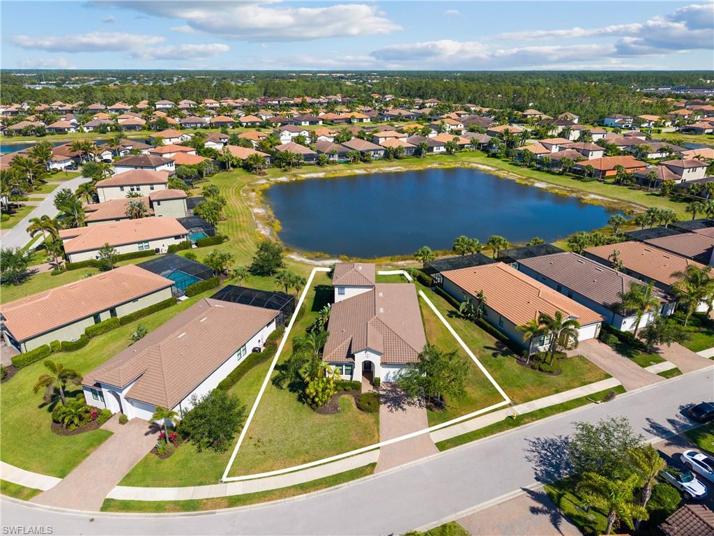 4711 Abaca Circle Naples, FL 34119 - Photo 1 of 32 an aerial view of residential houses with outdoor space