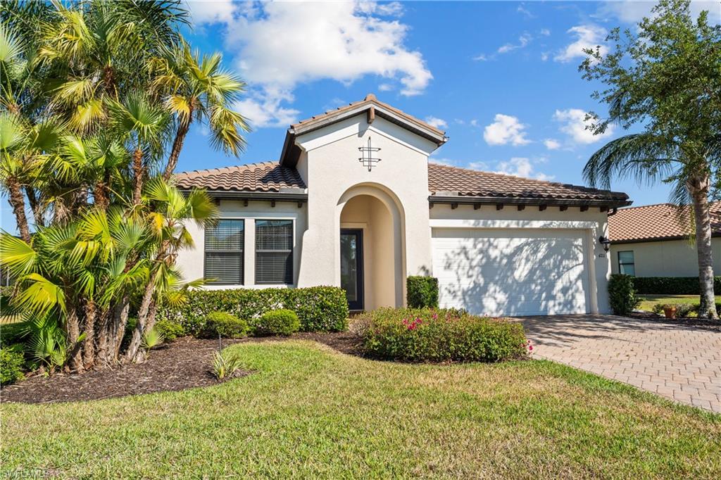 4711 Abaca Circle Naples, FL 34119 - Photo 26 of 32 a view of a house with a yard