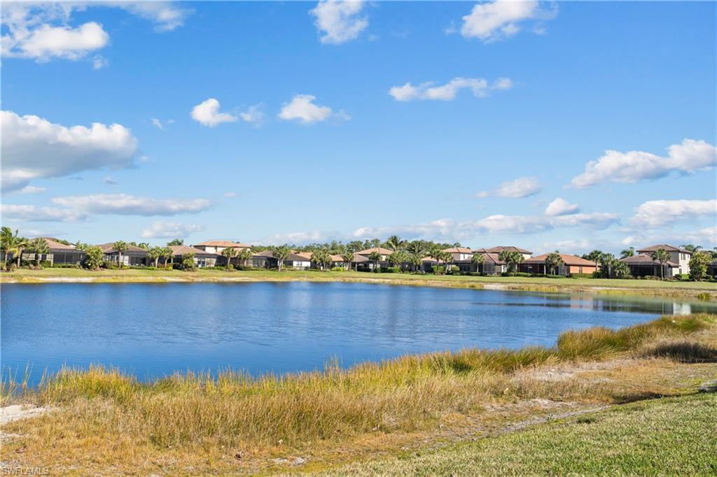 4711 Abaca Circle Naples, FL 34119 - Photo 29 of 32 a view of an lake and houses