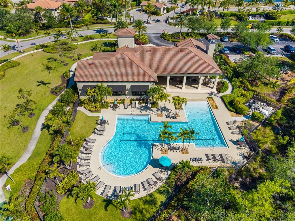 4711 Abaca Circle Naples, FL 34119 - Photo 31 of 32 an aerial view of house with swimming pool outdoor seating and yard