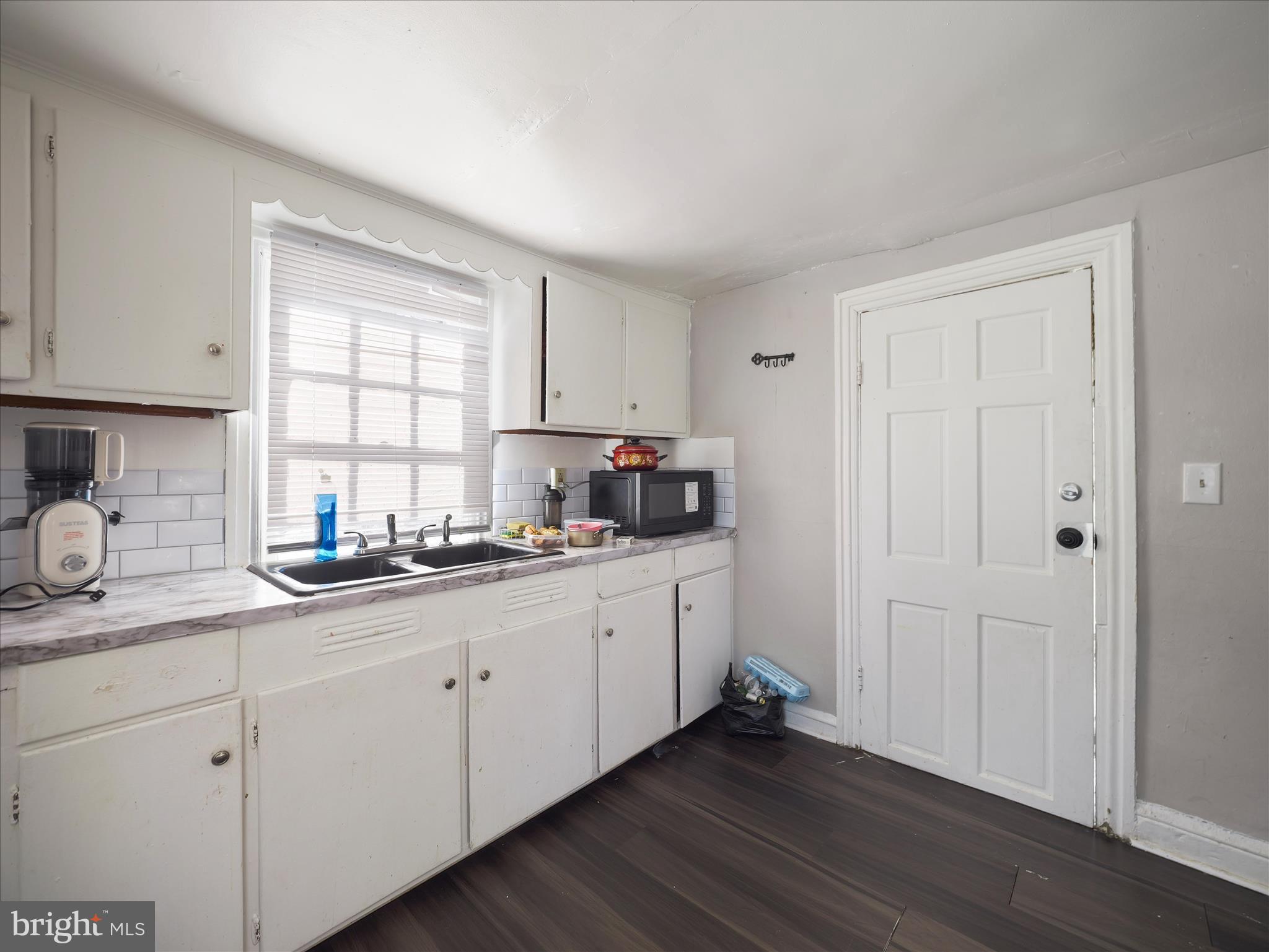 810 Broad Street Chambersburg, PA 17201 - Photo 11 of 16 a kitchen with granite countertop white cabinets and white appliances