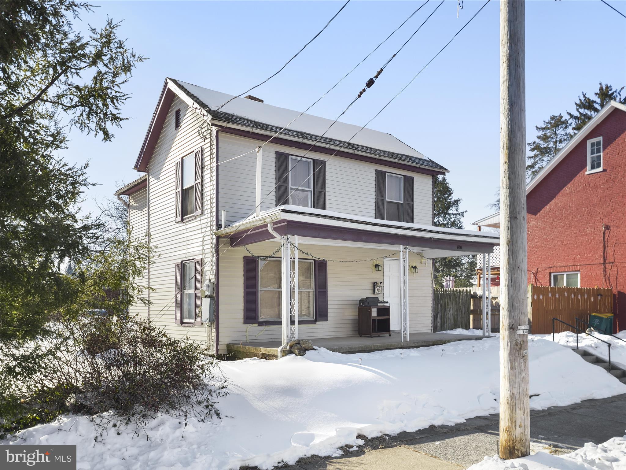 810 Broad Street Chambersburg, PA 17201 - Photo 2 of 16 a front view of a house with a yard