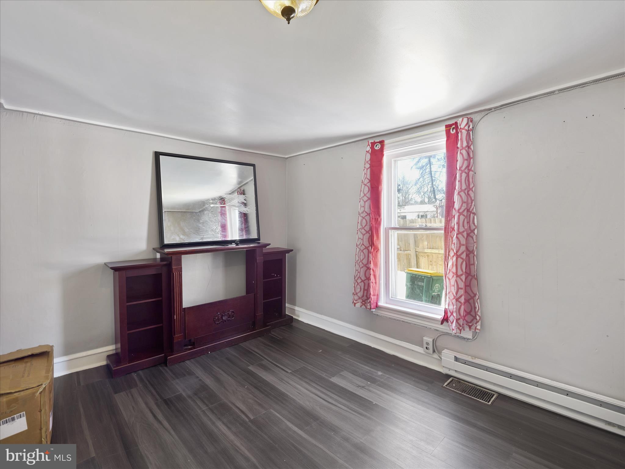 810 Broad Street Chambersburg, PA 17201 - Photo 6 of 16 an empty room with windows and cabinet