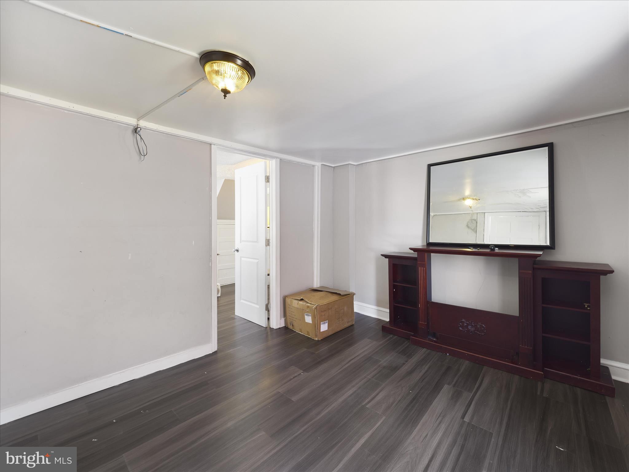 810 Broad Street Chambersburg, PA 17201 - Photo 7 of 16 a living room with furniture and a flat screen tv