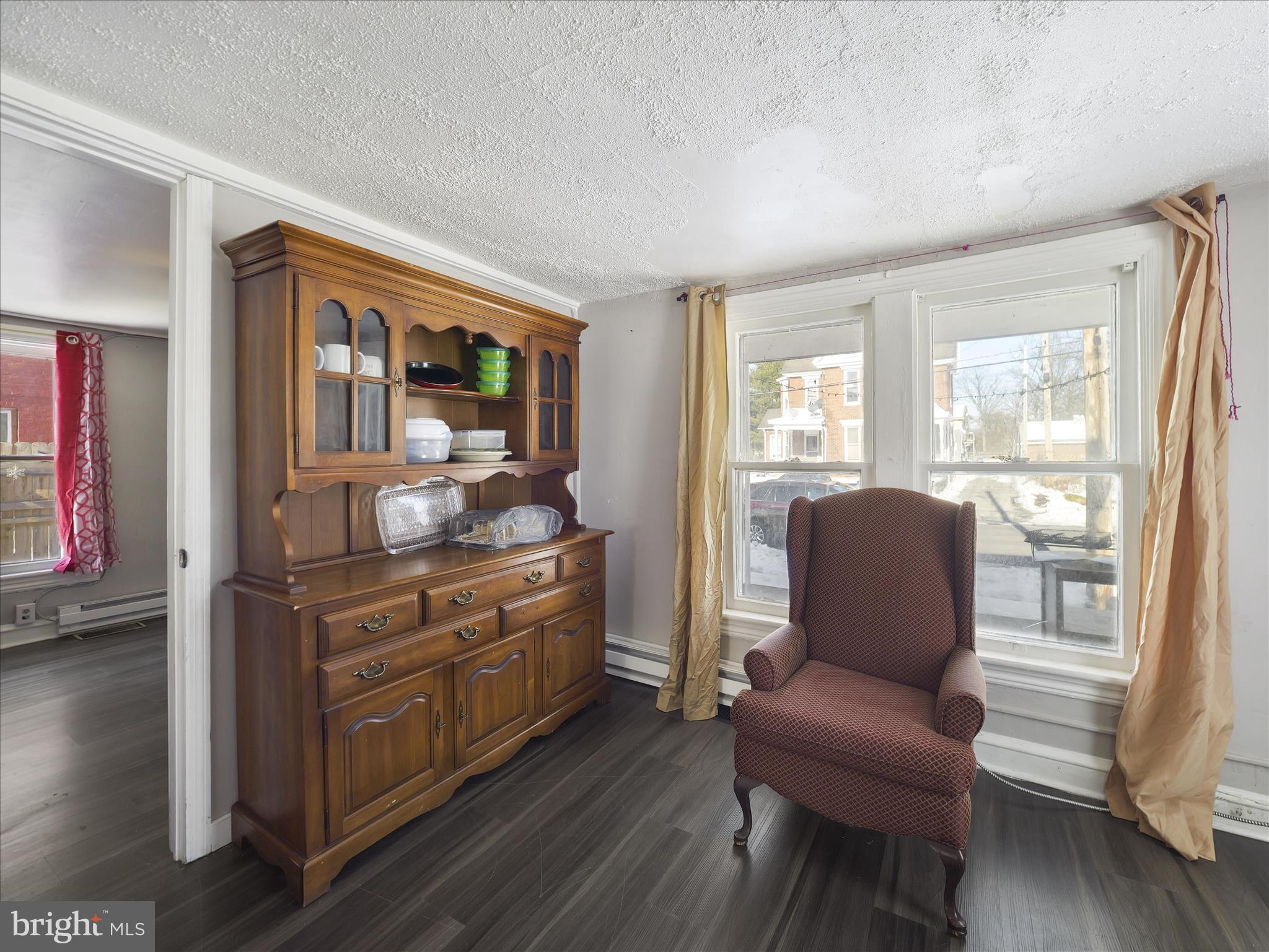 810 Broad Street Chambersburg, PA 17201 - Photo 9 of 16 a living room with furniture and wooden floor