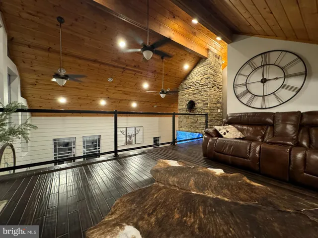 a living room with couch and a large window