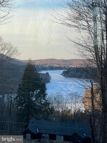 a view of lake with mountain