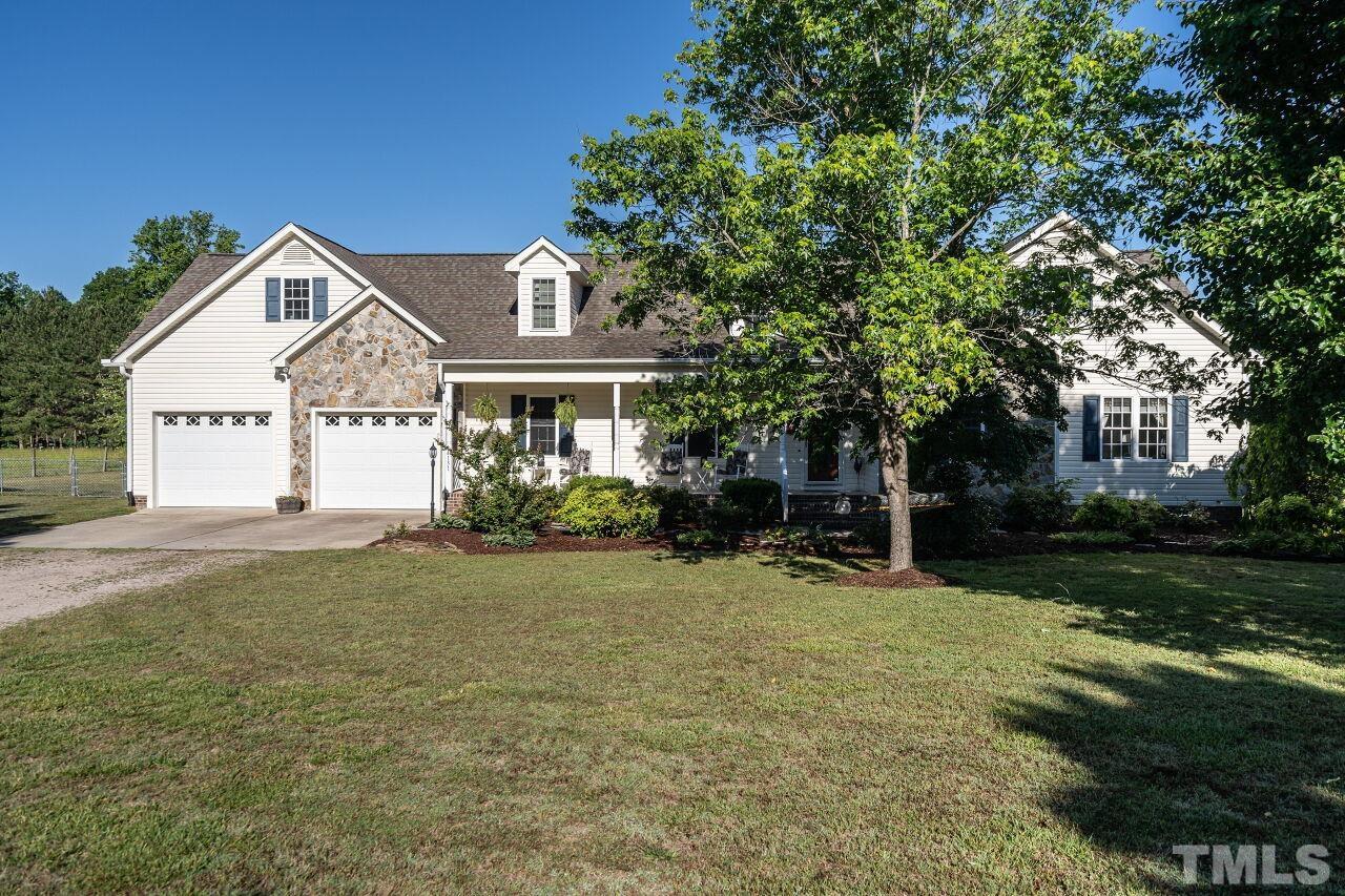 4131 Pearces Road Zebulon, NC 27597 - Photo 3 of 31 a view of a house with a outdoor space