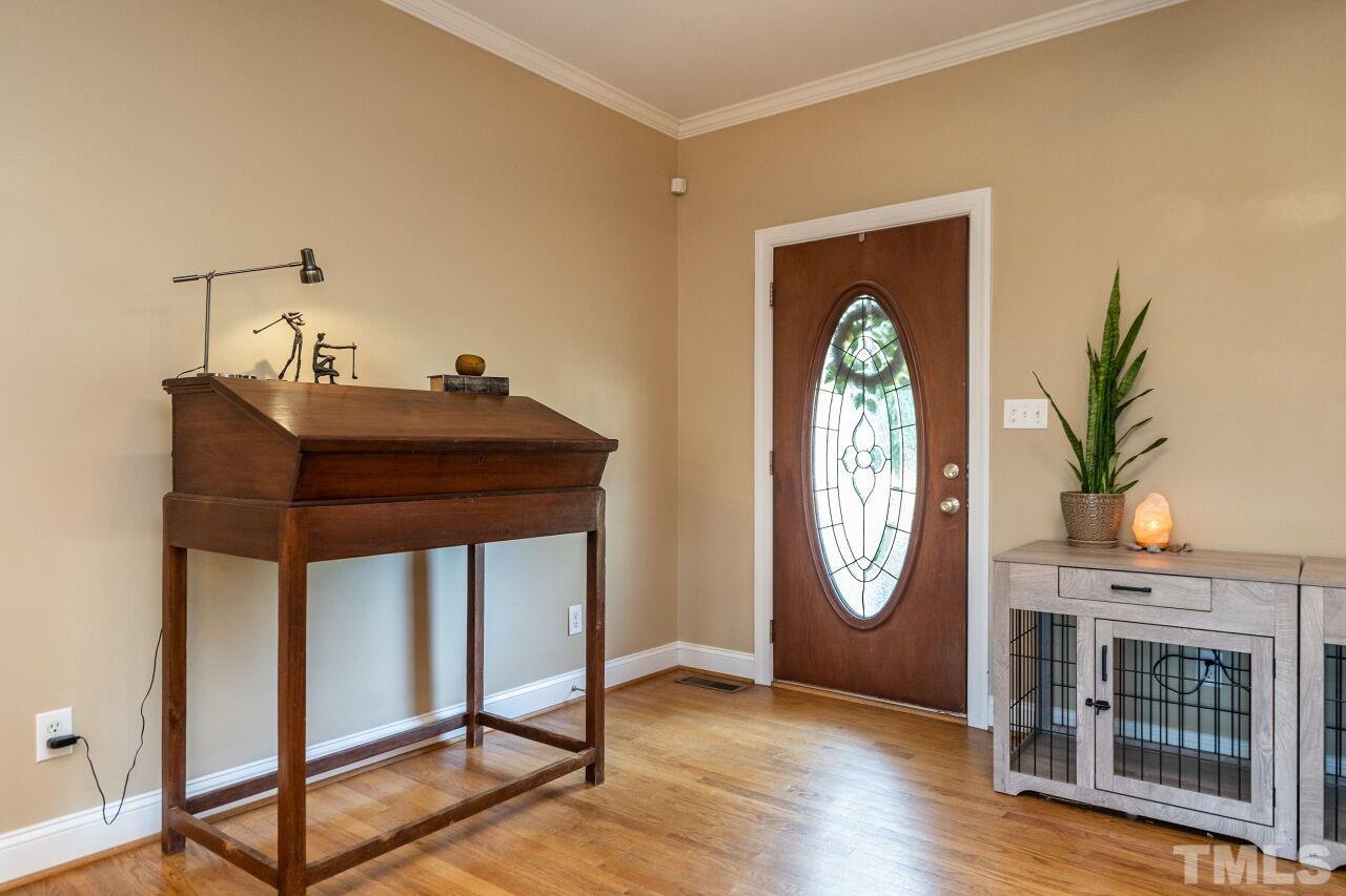 4131 Pearces Road Zebulon, NC 27597 - Photo 4 of 31 a grandfather clock sitting in the corner of a room