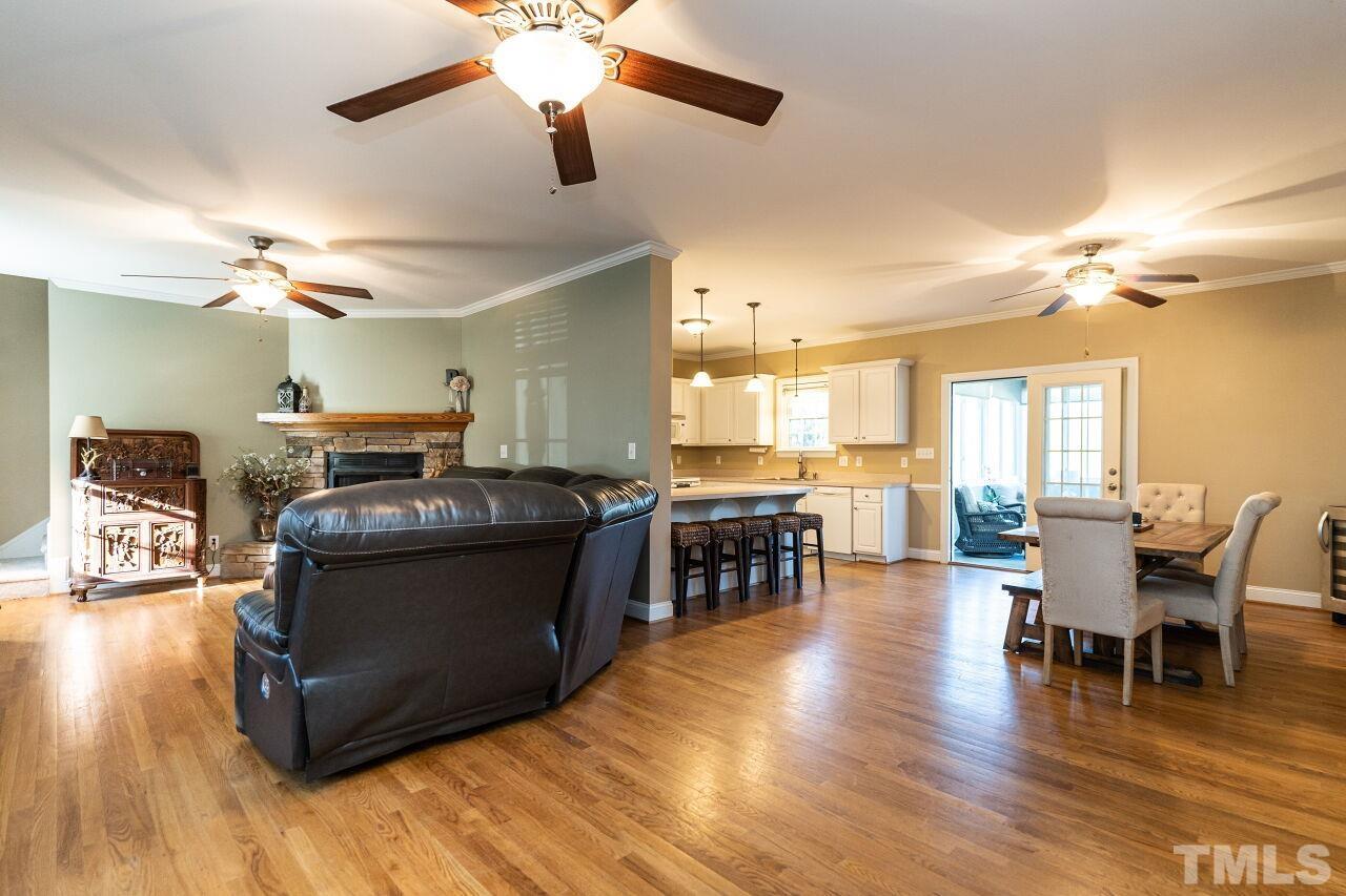 4131 Pearces Road Zebulon, NC 27597 - Photo 5 of 31 a living room with furniture and kitchen view
