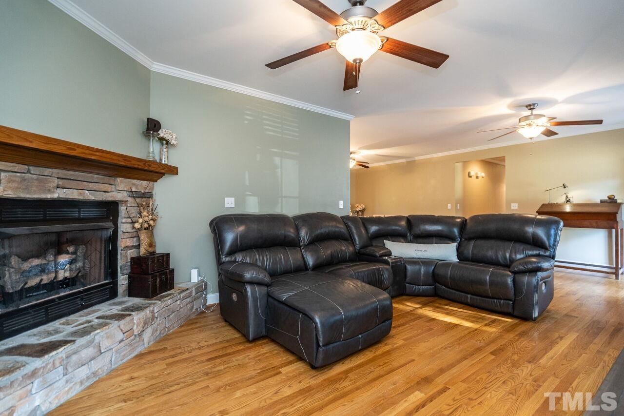 4131 Pearces Road Zebulon, NC 27597 - Photo 8 of 31 a living room with furniture and a fireplace
