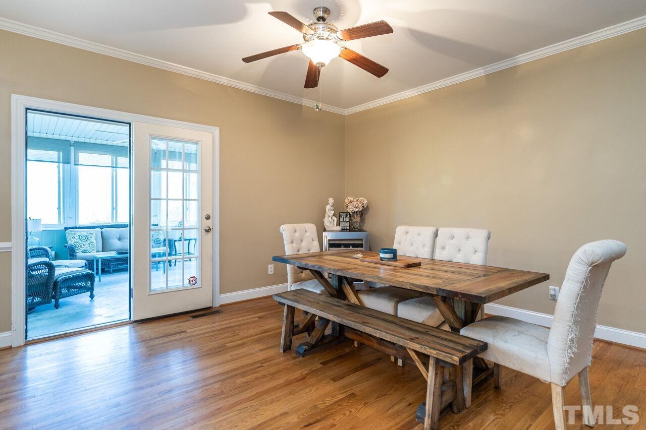 4131 Pearces Road Zebulon, NC 27597 - Photo 10 of 31 a view of a workspace with furniture and a window