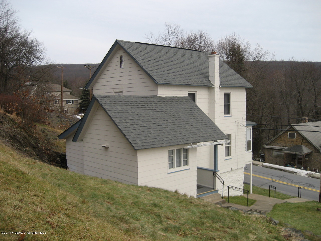 99 Jefferson Street Simpson, PA 18407 - Photo 13 of 16 a aerial view of a house next to a yard