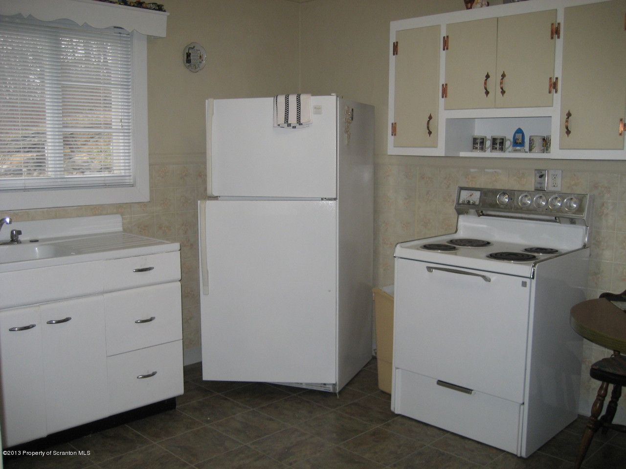 99 Jefferson Street Simpson, PA 18407 - Photo 3 of 16 a utility room with cabinets washer and dryer