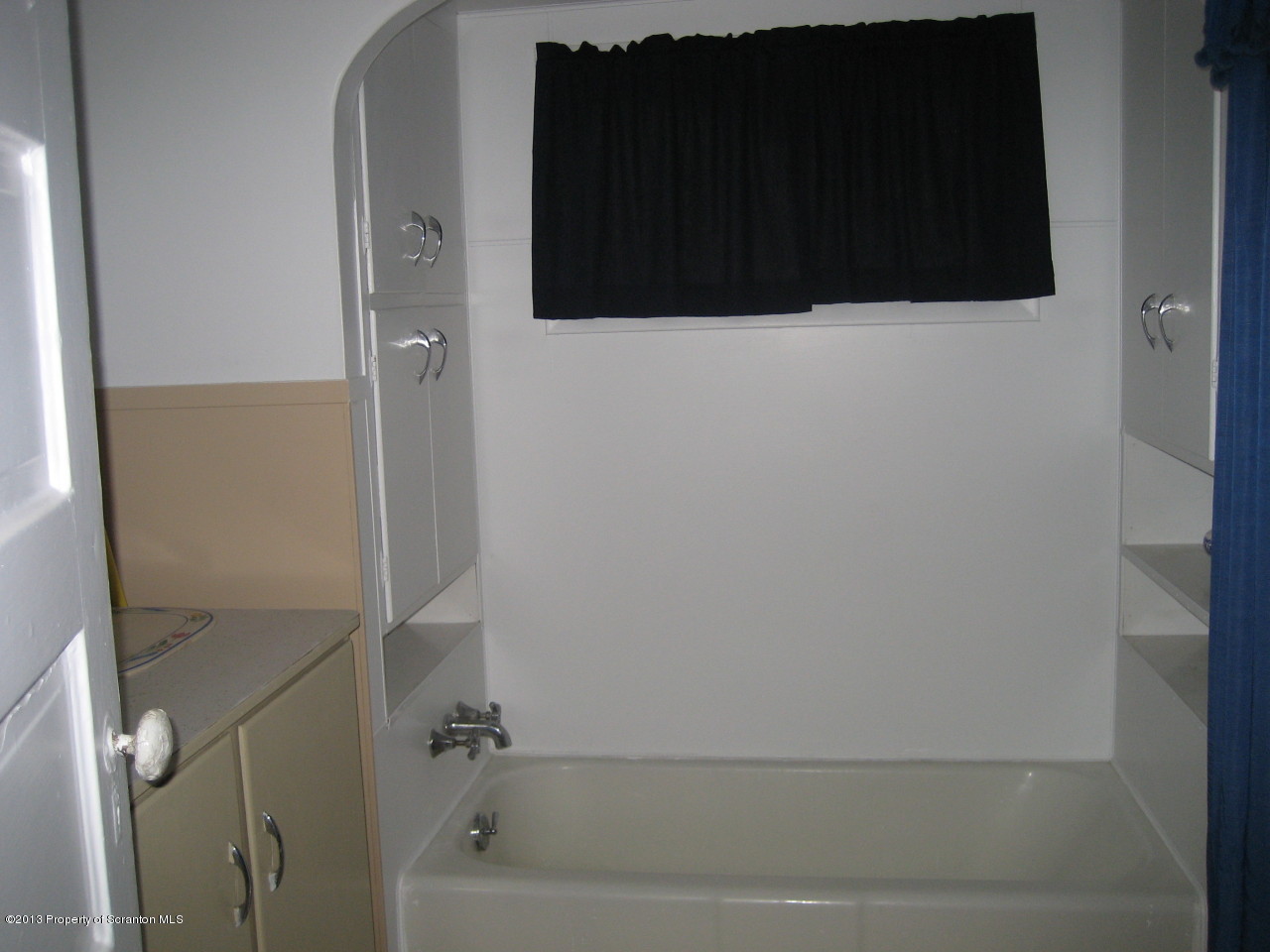 99 Jefferson Street Simpson, PA 18407 - Photo 4 of 16 a bathroom with a shower and a yard