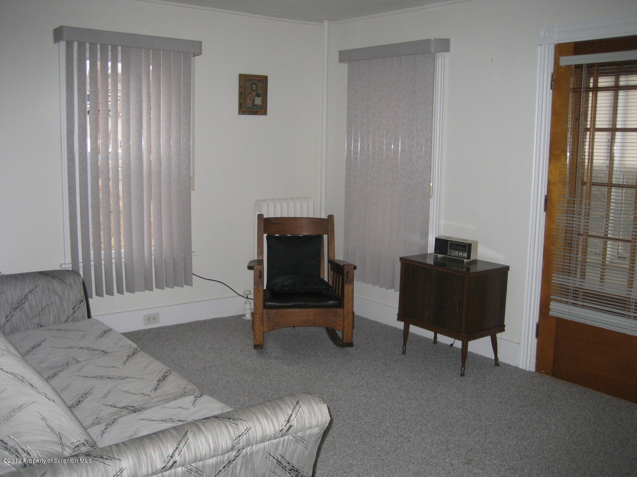 99 Jefferson Street Simpson, PA 18407 - Photo 6 of 16 a living room with furniture and a window