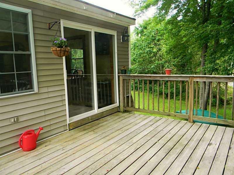 67 Maple Grove South China, ME 04358 - Photo 5 of 33 Direct access to deck from sliders...