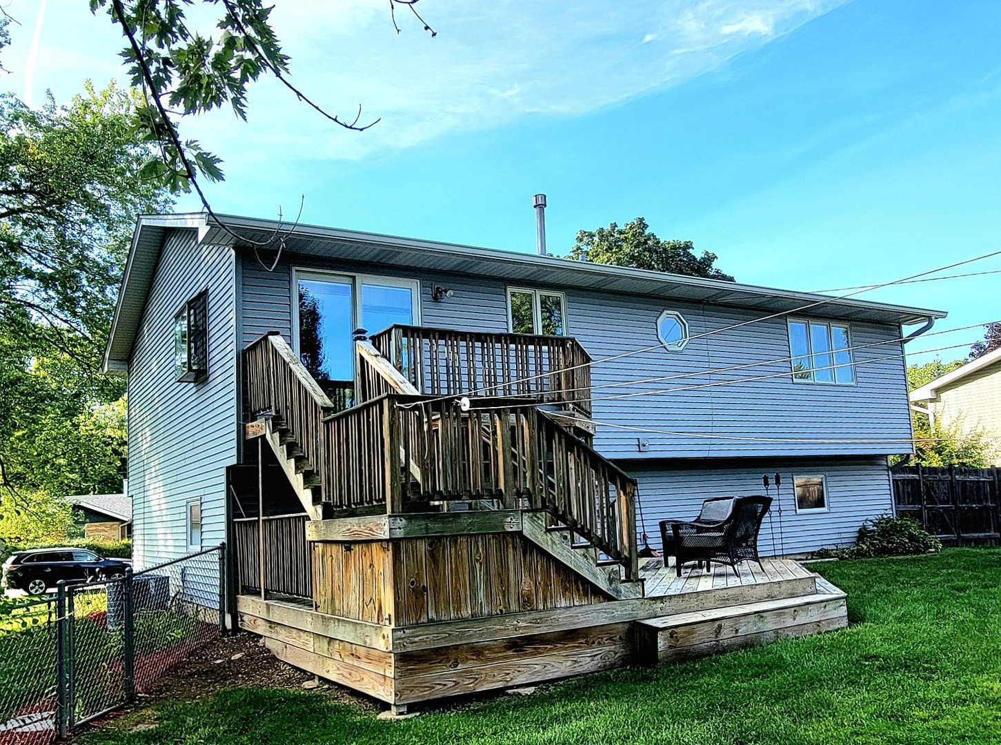 205 Countryside Lane Lindenhurst, IL 60046 - Photo 29 of 33 a view of a patio with a table chairs and a small yard