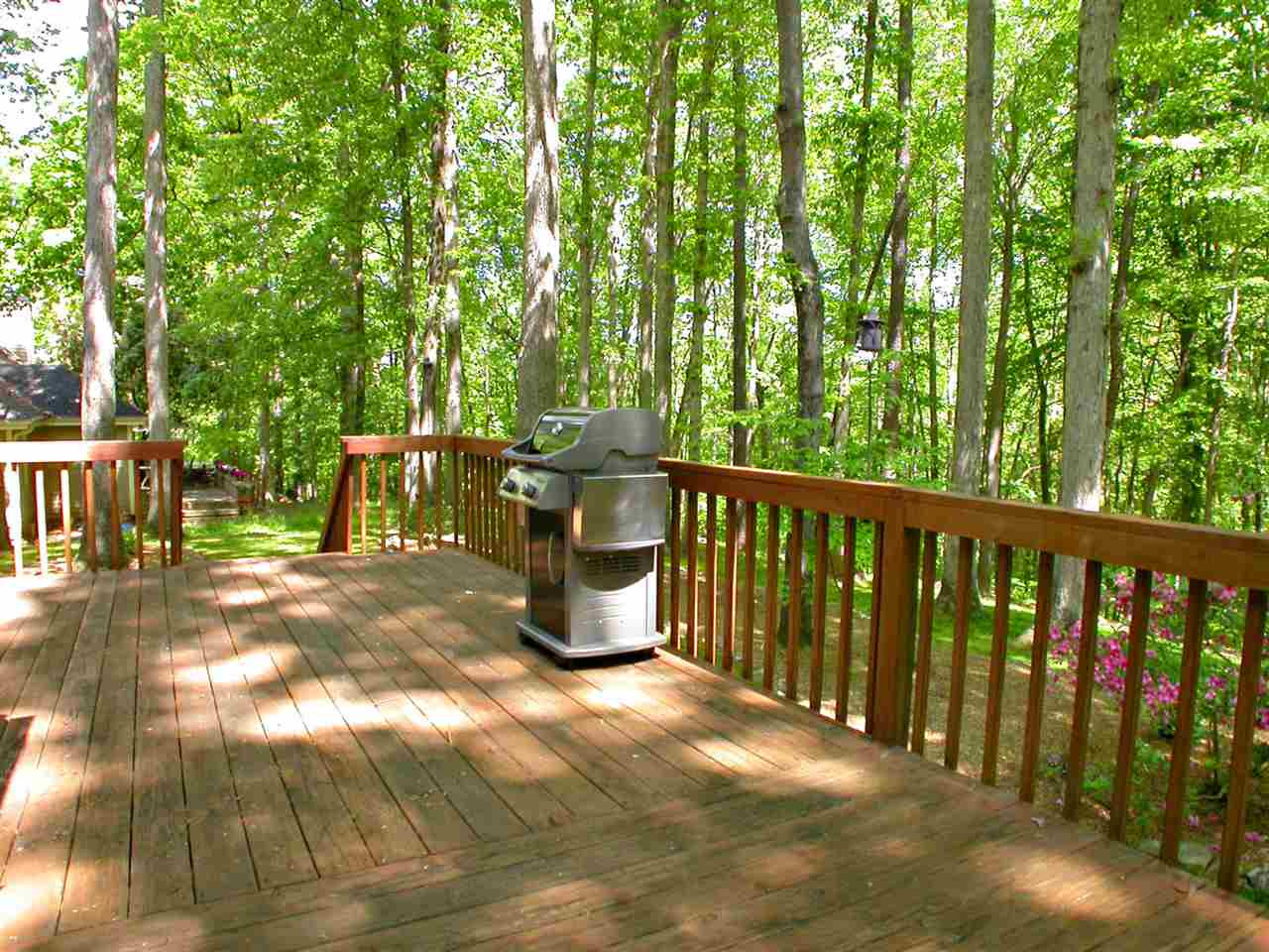 11812 Mountbatten Way Raleigh, NC 27613 - Photo 20 of 25 Deck spans the back of the house & overlooks wooded buffer. Deck