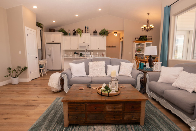 745 East 885 North Beaver, UT 84713 - Photo 13 of 50 Living room featuring wood finished floors, suspended lighting, and lofted ceiling