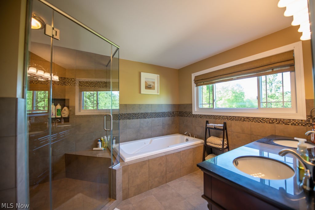5234 Ribbon Road Southwest Bowerston, OH 44695 - Photo 25 of 50 Spacious primary bathroom featuring a glass-enclosed shower.