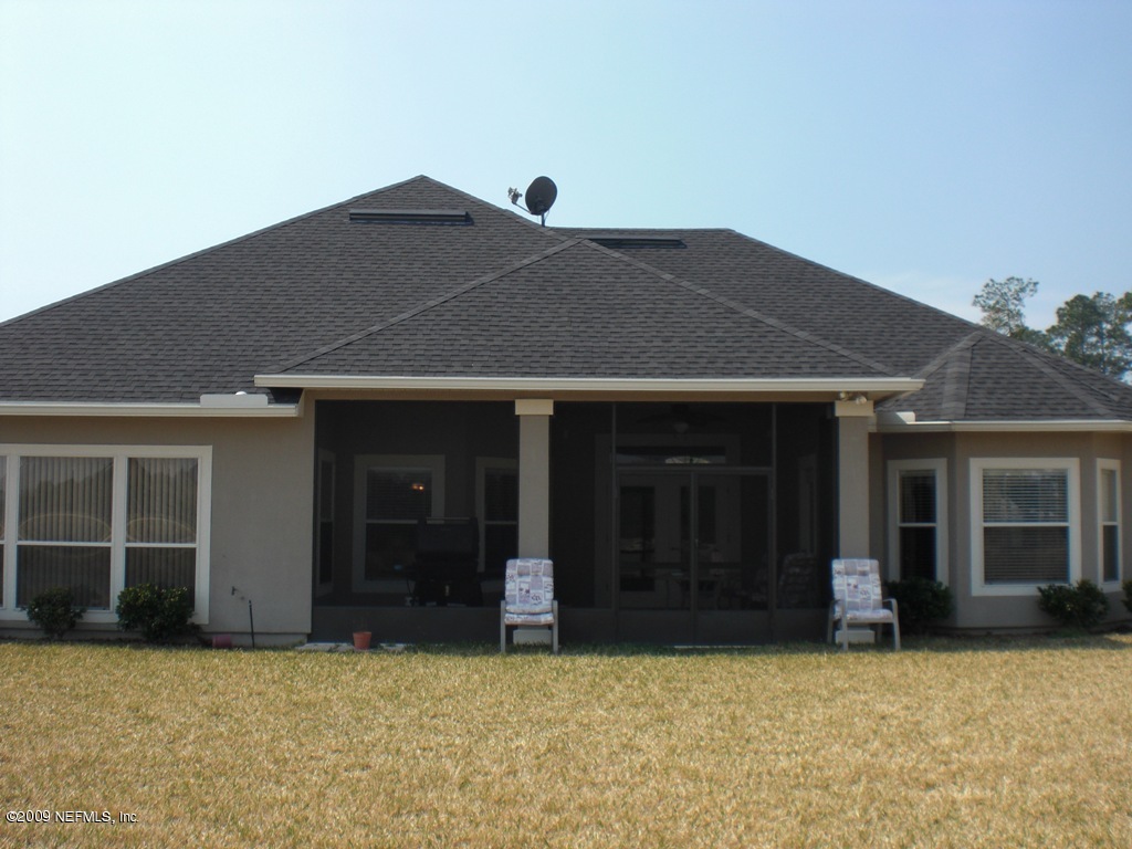 2018 River's Own Road St. Augustine, FL 32092 - Photo 2 of 32 a house that has a tree in front of it