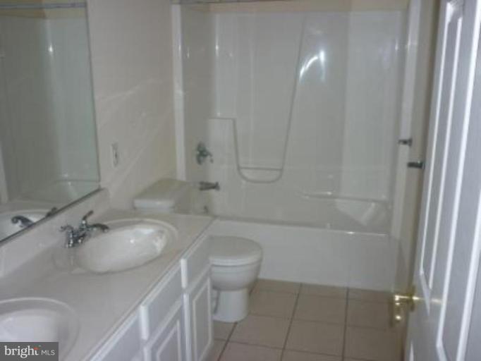 1413 Woodridge Manor Road Fallston, MD 21047 - Photo 19 of 21 a bathroom with a sink toilet and shower