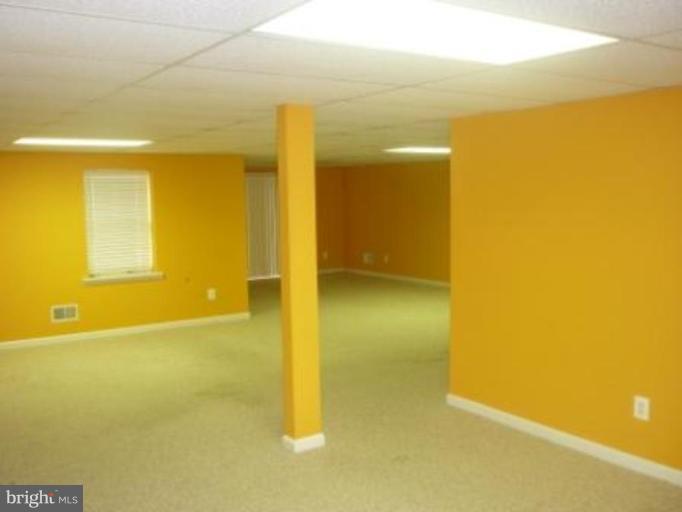 1413 Woodridge Manor Road Fallston, MD 21047 - Photo 3 of 21 a view of an empty room with a window