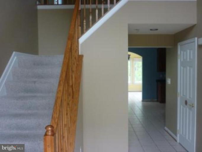 1413 Woodridge Manor Road Fallston, MD 21047 - Photo 7 of 21 a view of a hallway with wooden floor and entryway