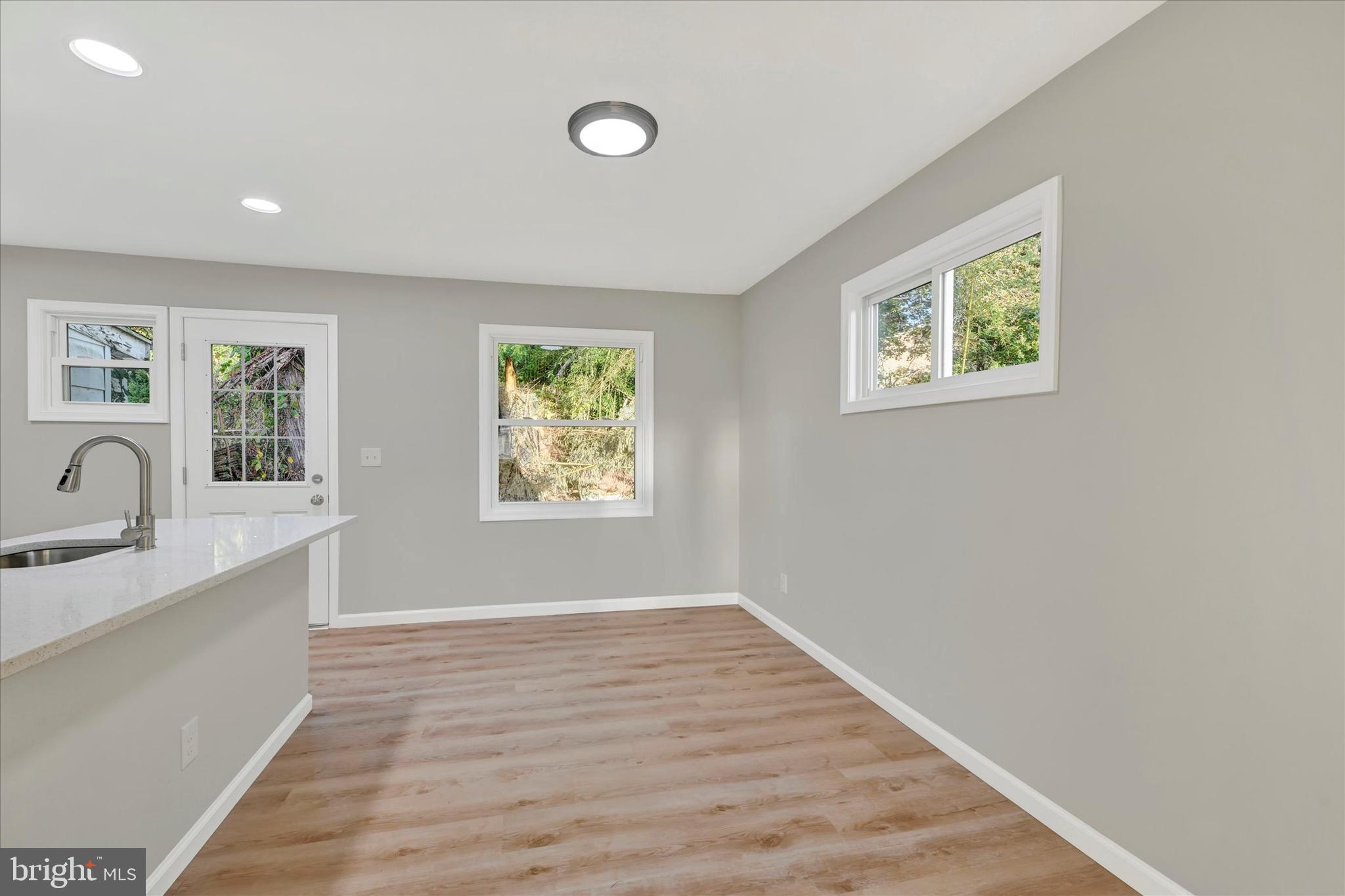 12106 Bluhill Road Silver Spring, MD 20902 - Photo 5 of 16 an empty room with windows