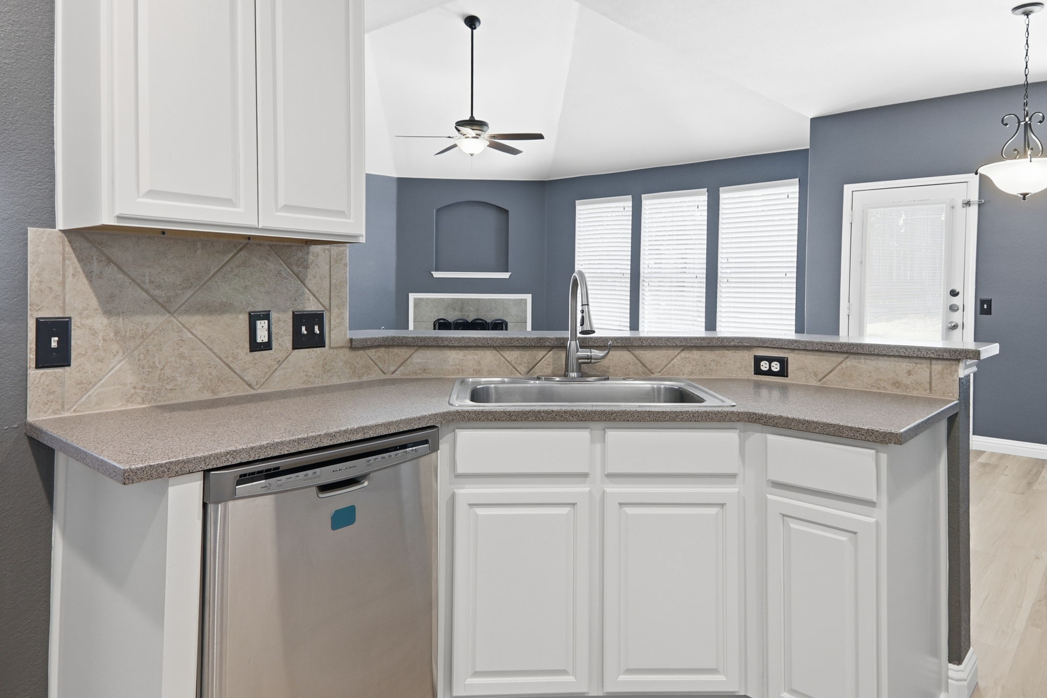 2157 Paradise Ridge Drive Round Rock, TX 78665 - Photo 12 of 34 a kitchen with stainless steel appliances granite countertop a sink and dishwasher with white cabinets
