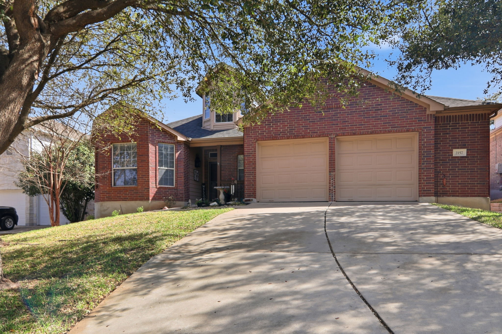 2157 Paradise Ridge Drive Round Rock, TX 78665 - Photo 2 of 34 a front view of a house with a yard and garage