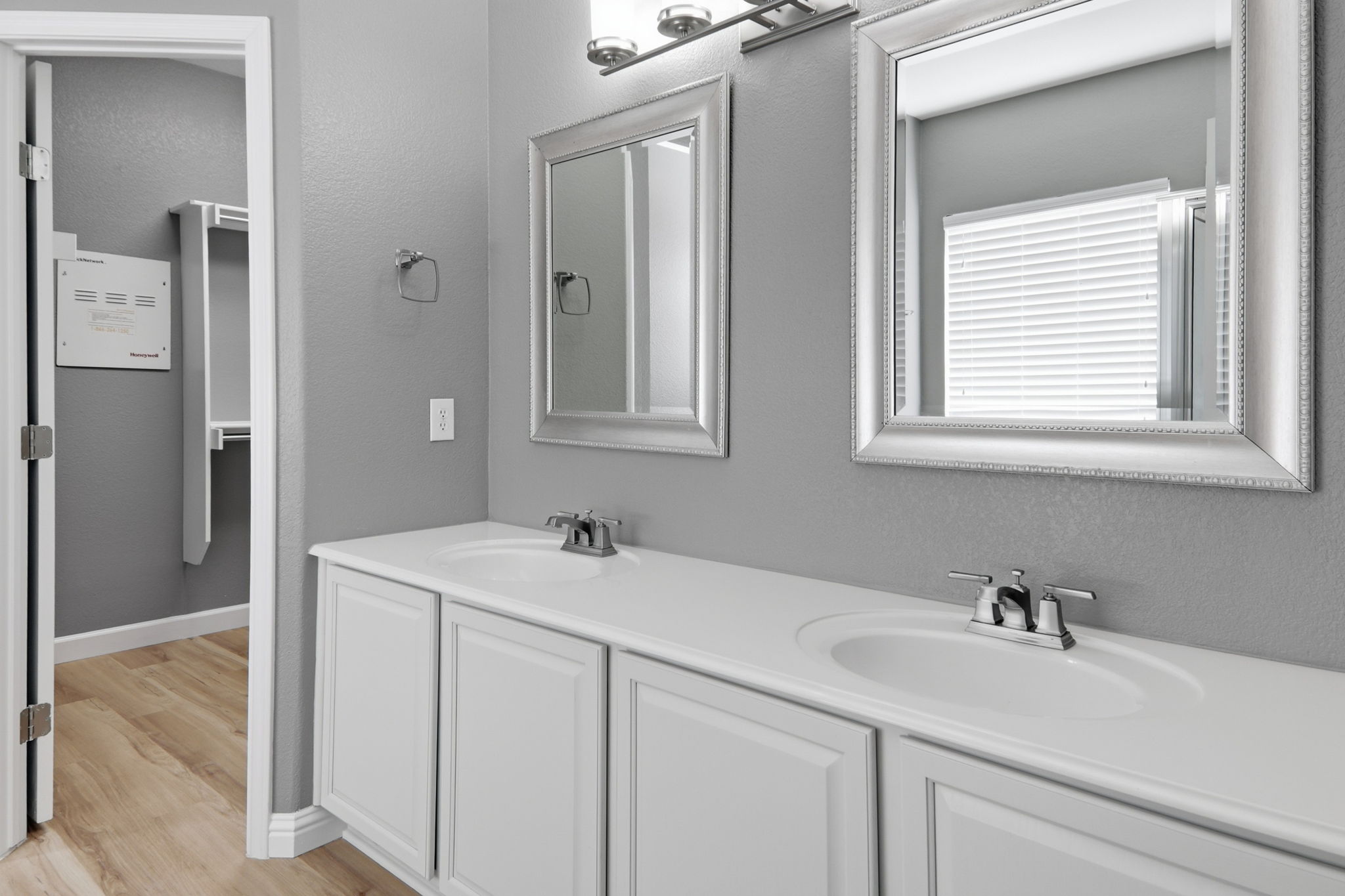 2157 Paradise Ridge Drive Round Rock, TX 78665 - Photo 24 of 34 a bathroom with a sink and a mirror
