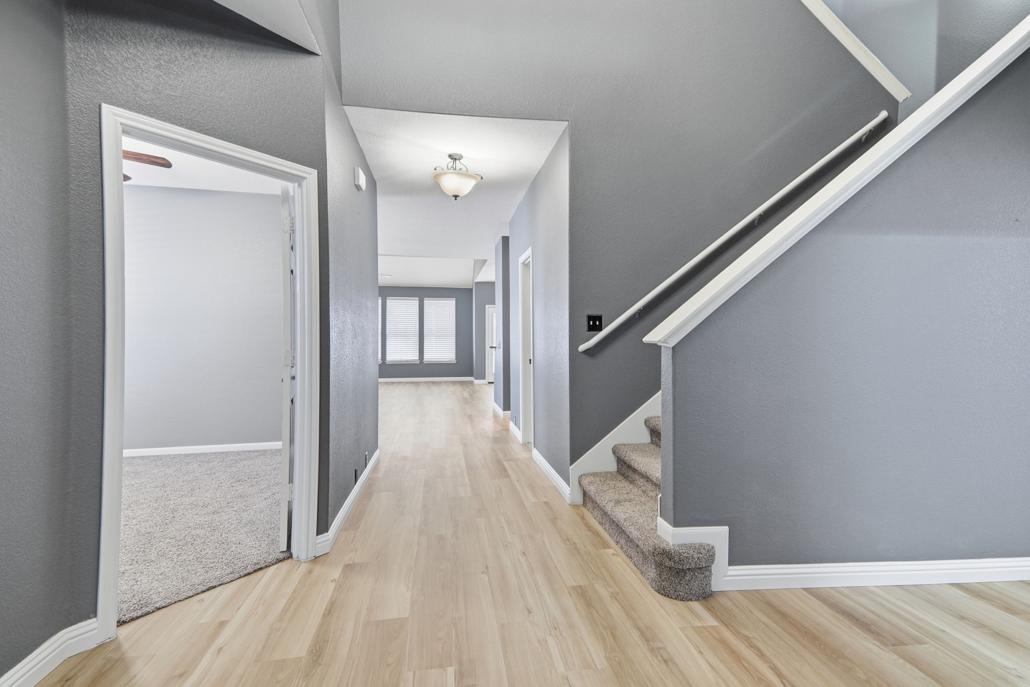 2157 Paradise Ridge Drive Round Rock, TX 78665 - Photo 4 of 34 a view of a hallway view with wooden floor and staircase
