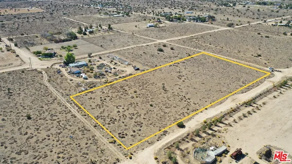 a view of a big yard with an outdoor space