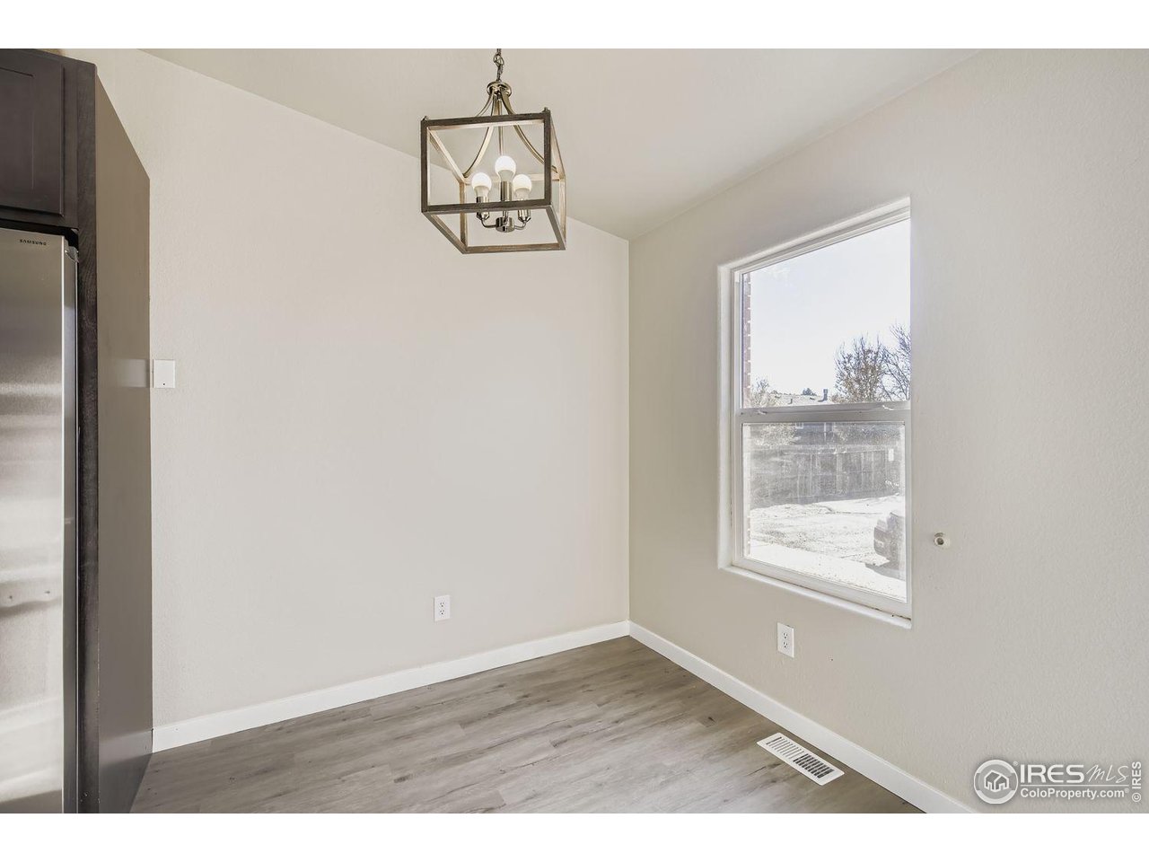 1303 Darrell Road Evans, CO 80620 - Photo 12 of 31 a view of an empty room with a window