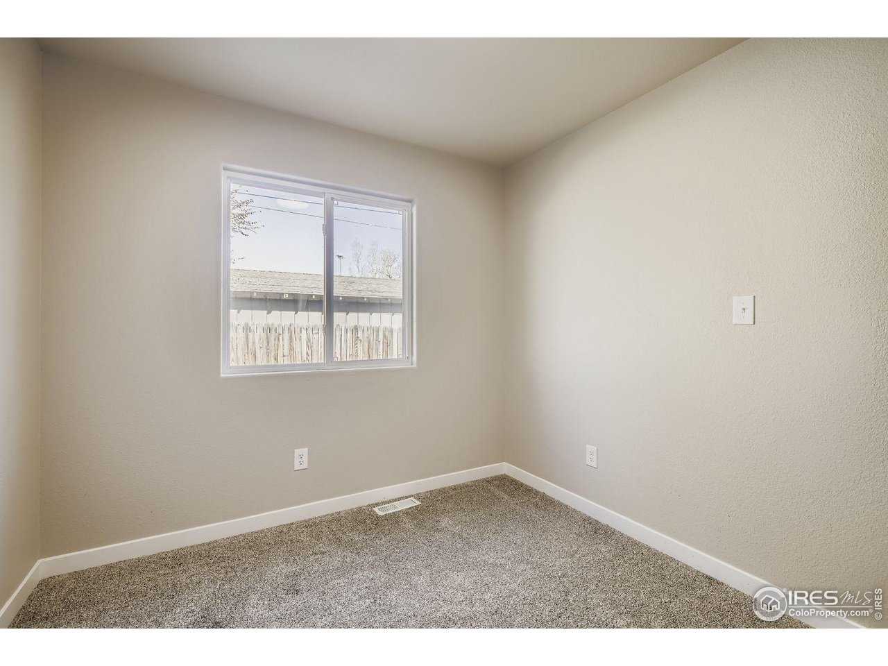 1303 Darrell Road Evans, CO 80620 - Photo 16 of 31 an empty room with a window