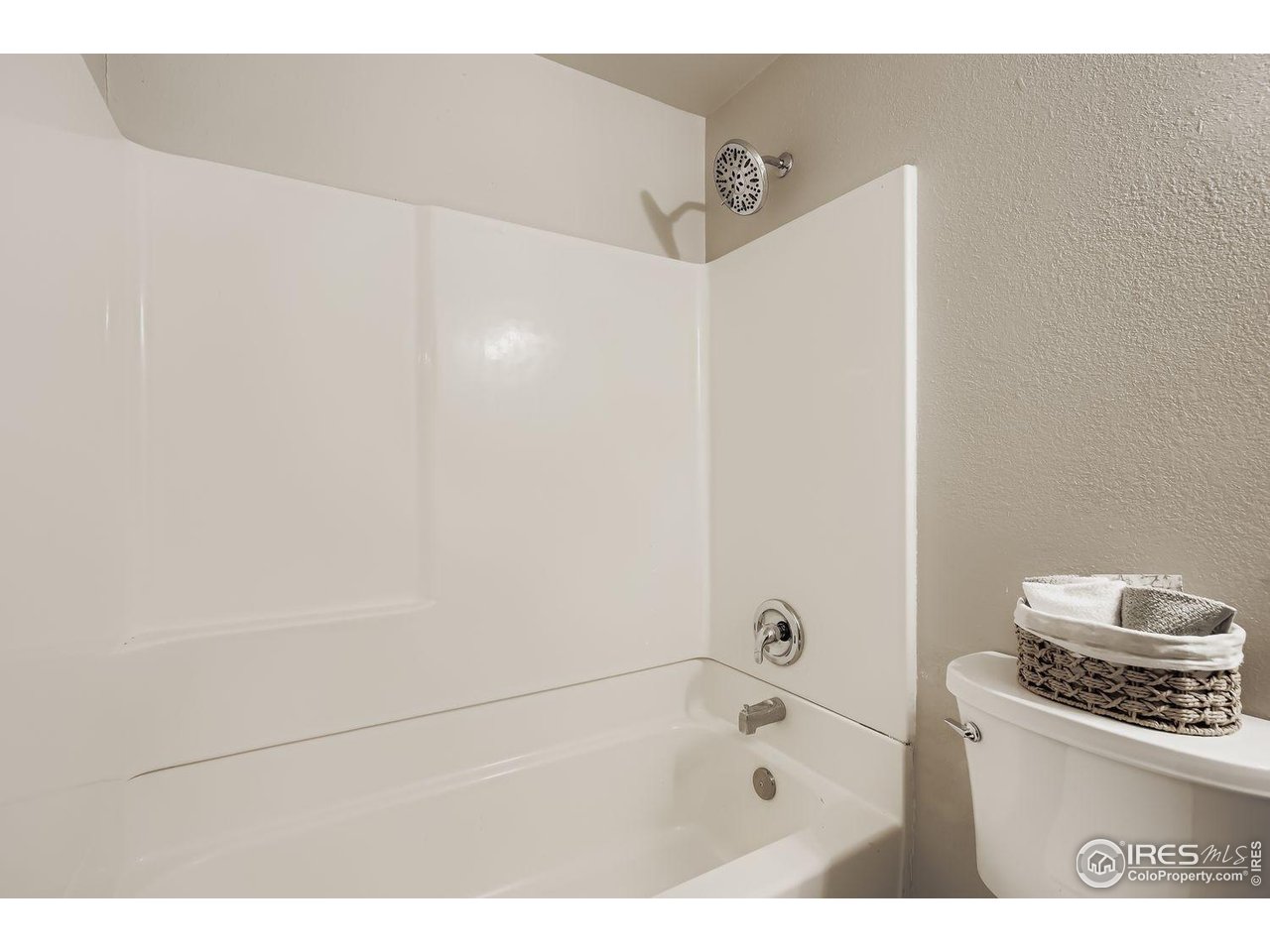 1303 Darrell Road Evans, CO 80620 - Photo 18 of 31 a bathroom with a bathtub