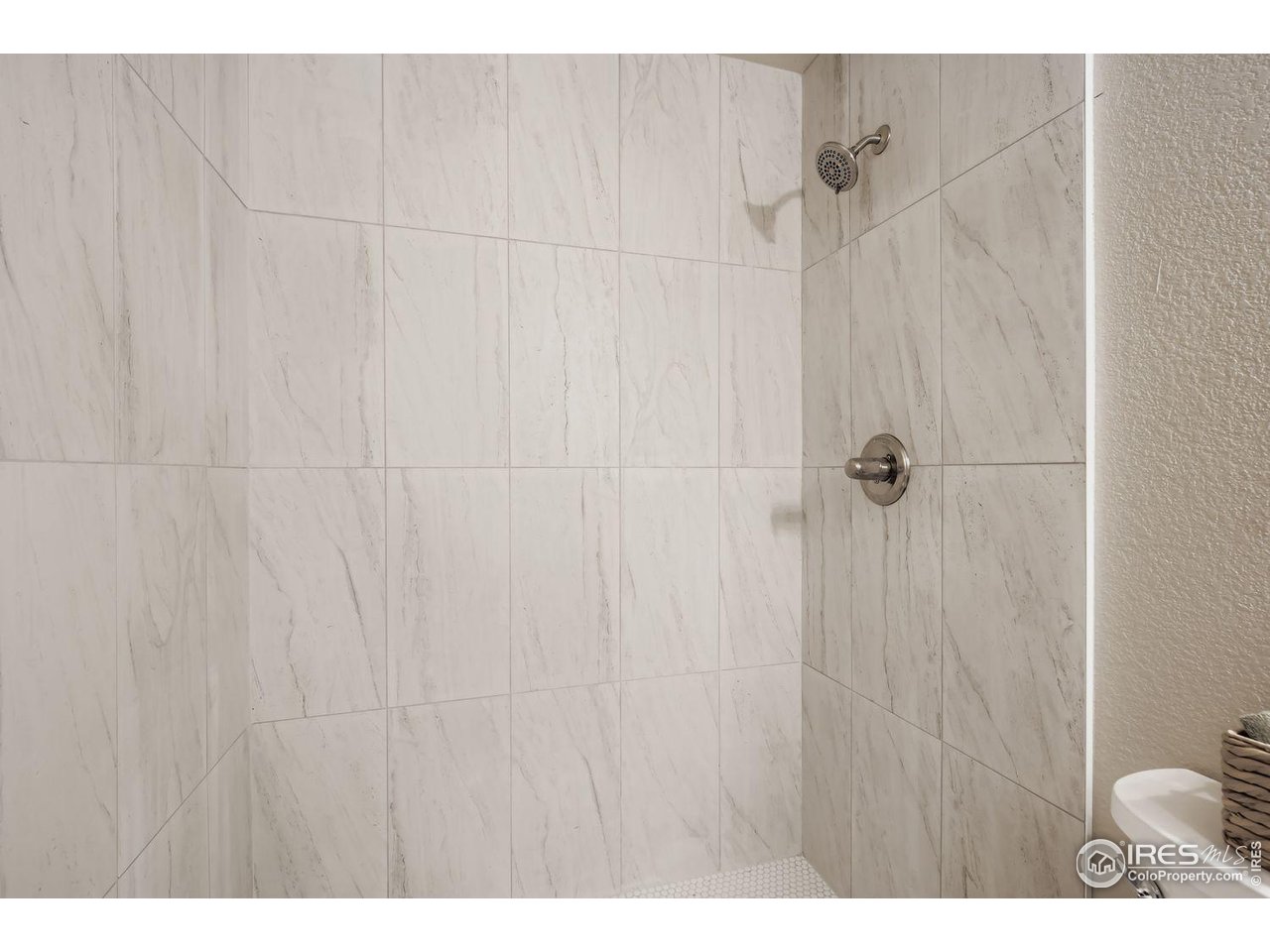 1303 Darrell Road Evans, CO 80620 - Photo 21 of 31 a bathroom with a shower