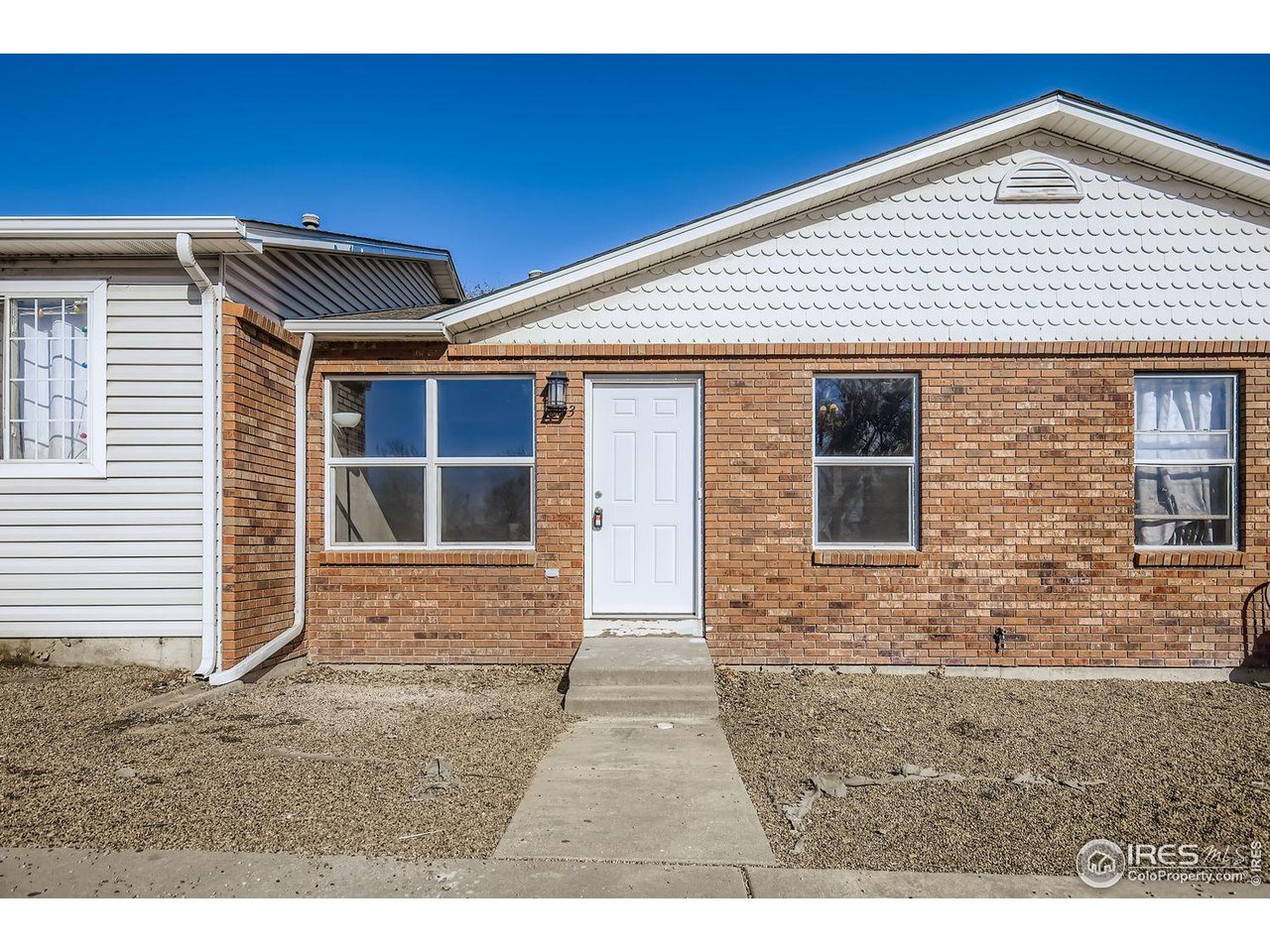 1303 Darrell Road Evans, CO 80620 - Photo 3 of 31 a view front of house with an outdoor space
